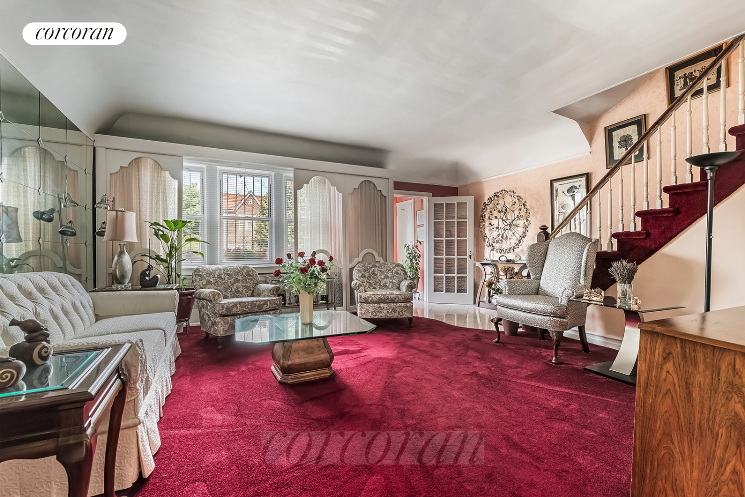 a living room with furniture rug and white walls