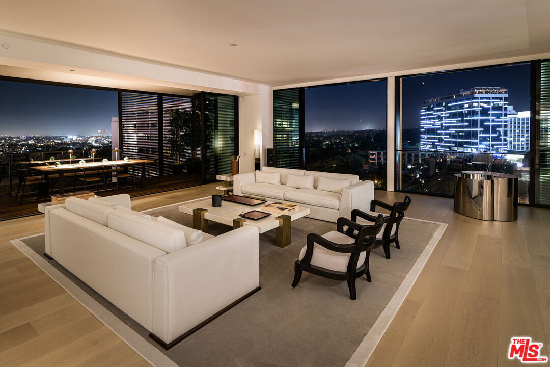 a living room with furniture a rug and a fireplace