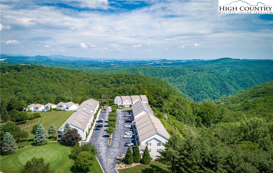 an aerial view of house with yard