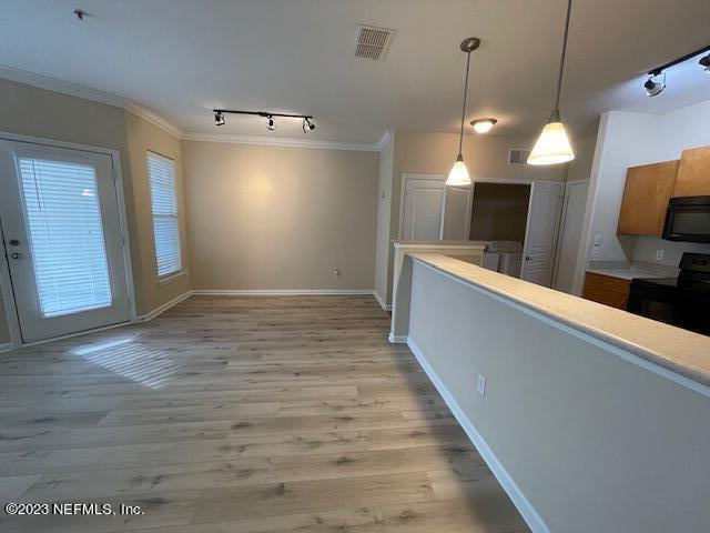 a view of a kitchen with a sink and dishwasher wooden floor