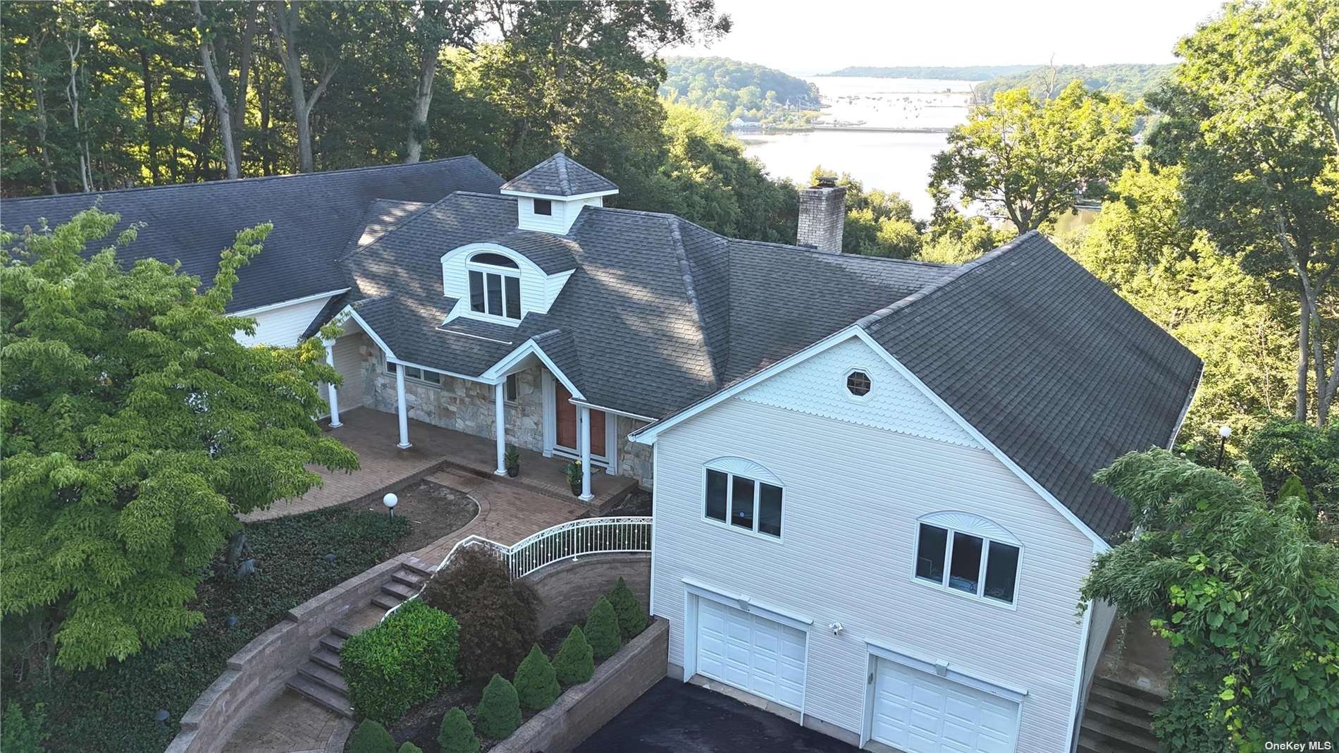 a aerial view of a house with a yard