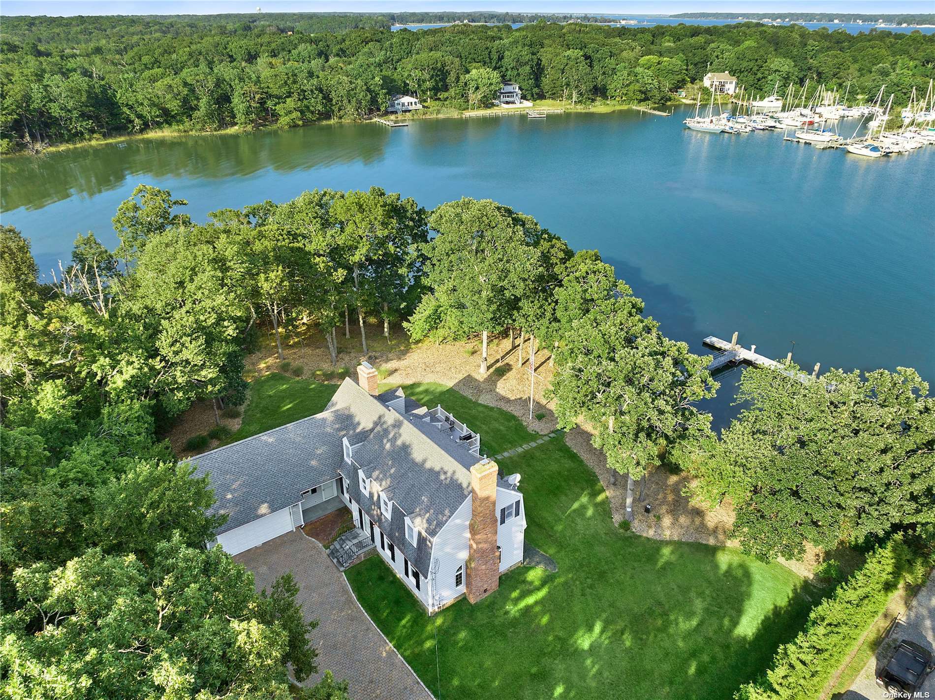 an aerial view of a house with a lake view