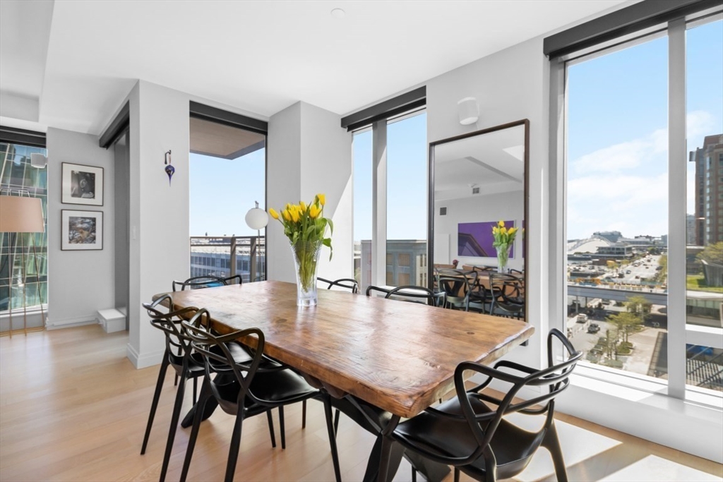 a dining room with furniture and wooden floor