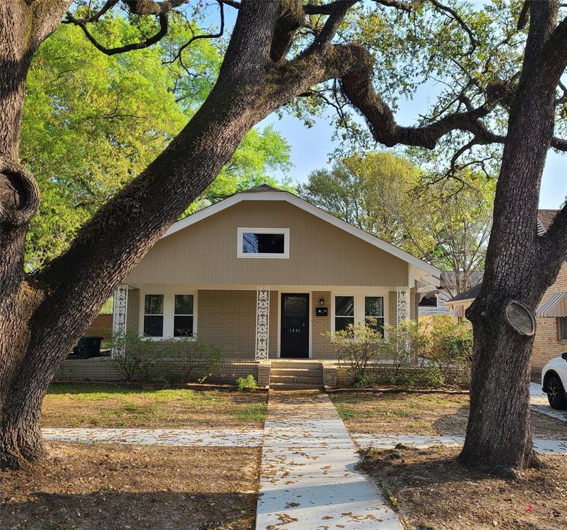 a house with a tree in front of it