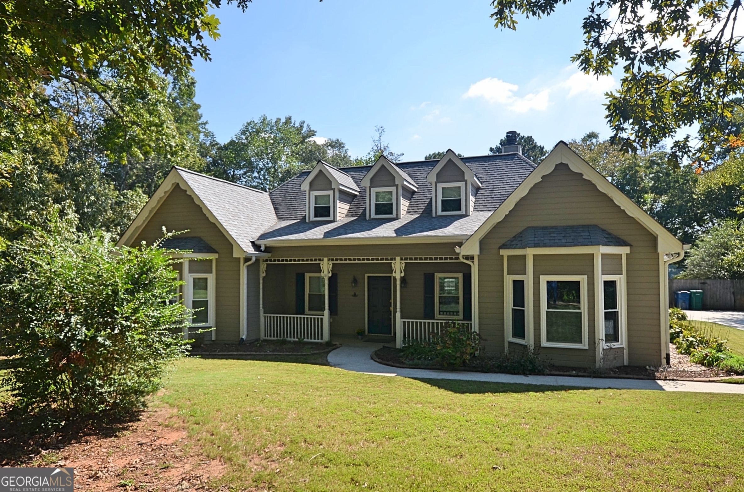 front view of a house with a yard