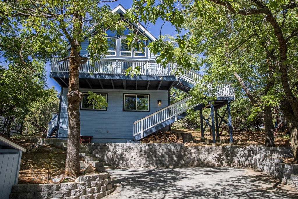 a view of a house with a tree