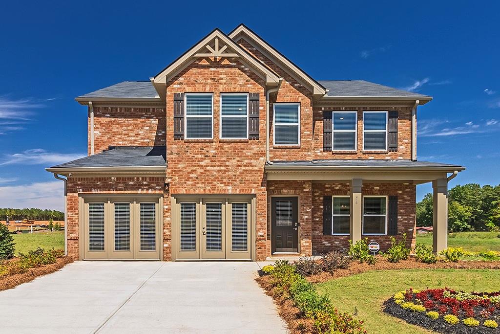 front view of a house with a yard