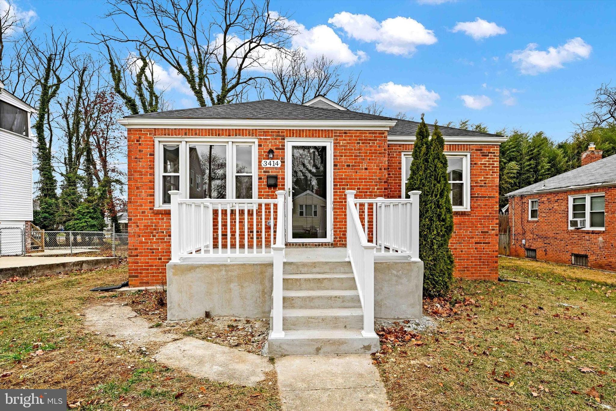 front view of a house with a yard