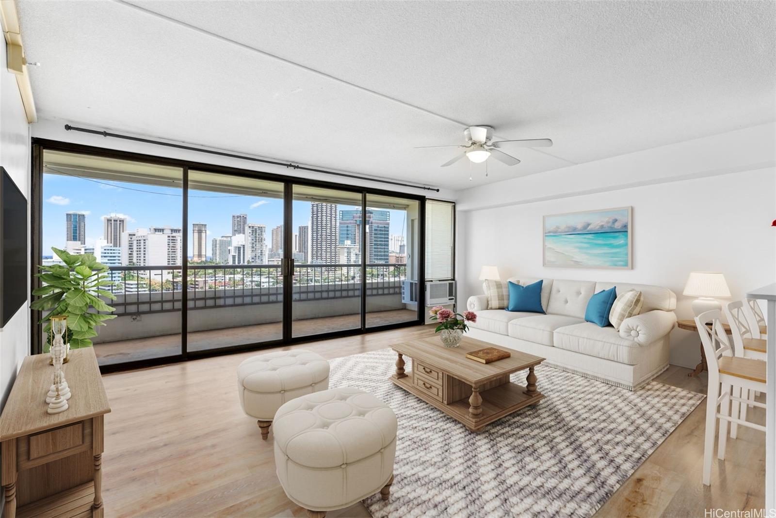 Experience breathtaking panoramic views of the Honolulu skyline, the Ala Wai Canal, and the ocean horizon from the heart of this home.