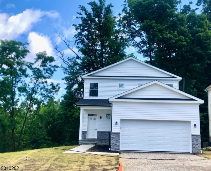 a house with trees in the background