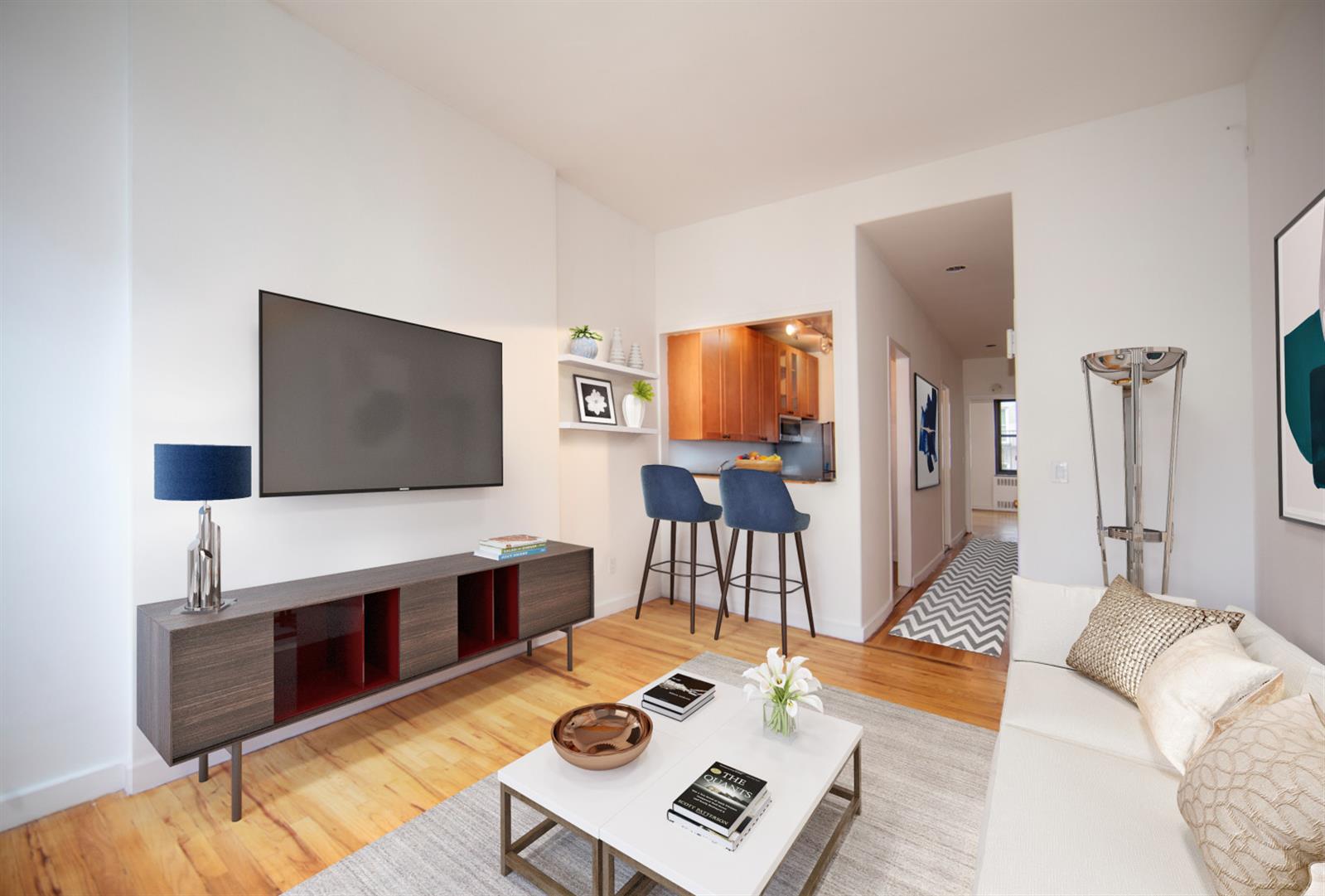 a living room with furniture and a flat screen tv