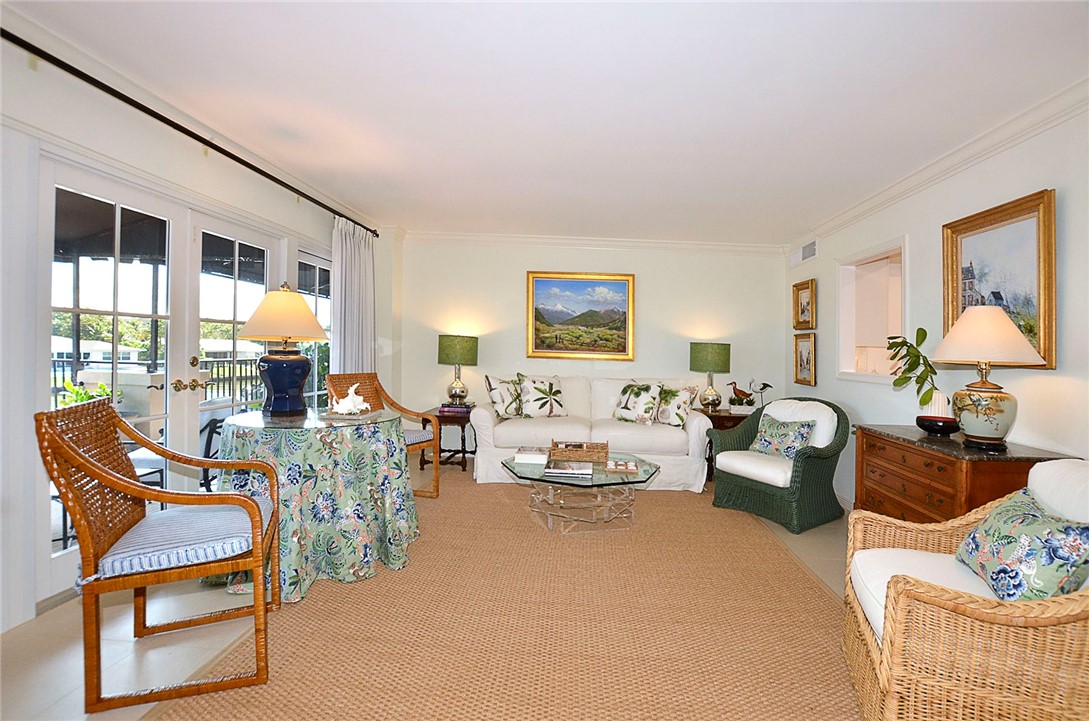 a living room with furniture and a lamp