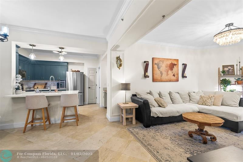 a living room with furniture a rug and a table