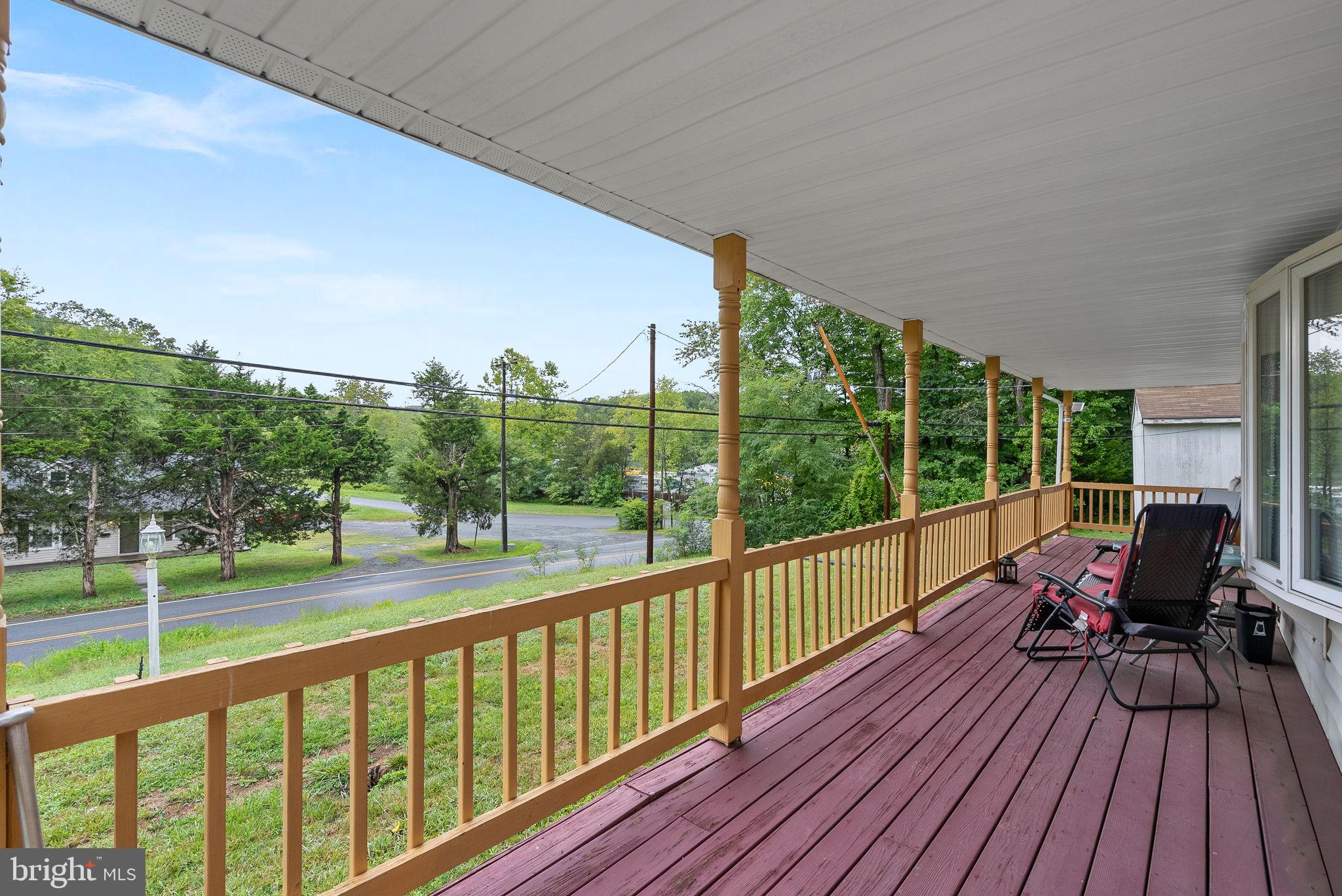 a view of balcony with wooden floor and outdoor space