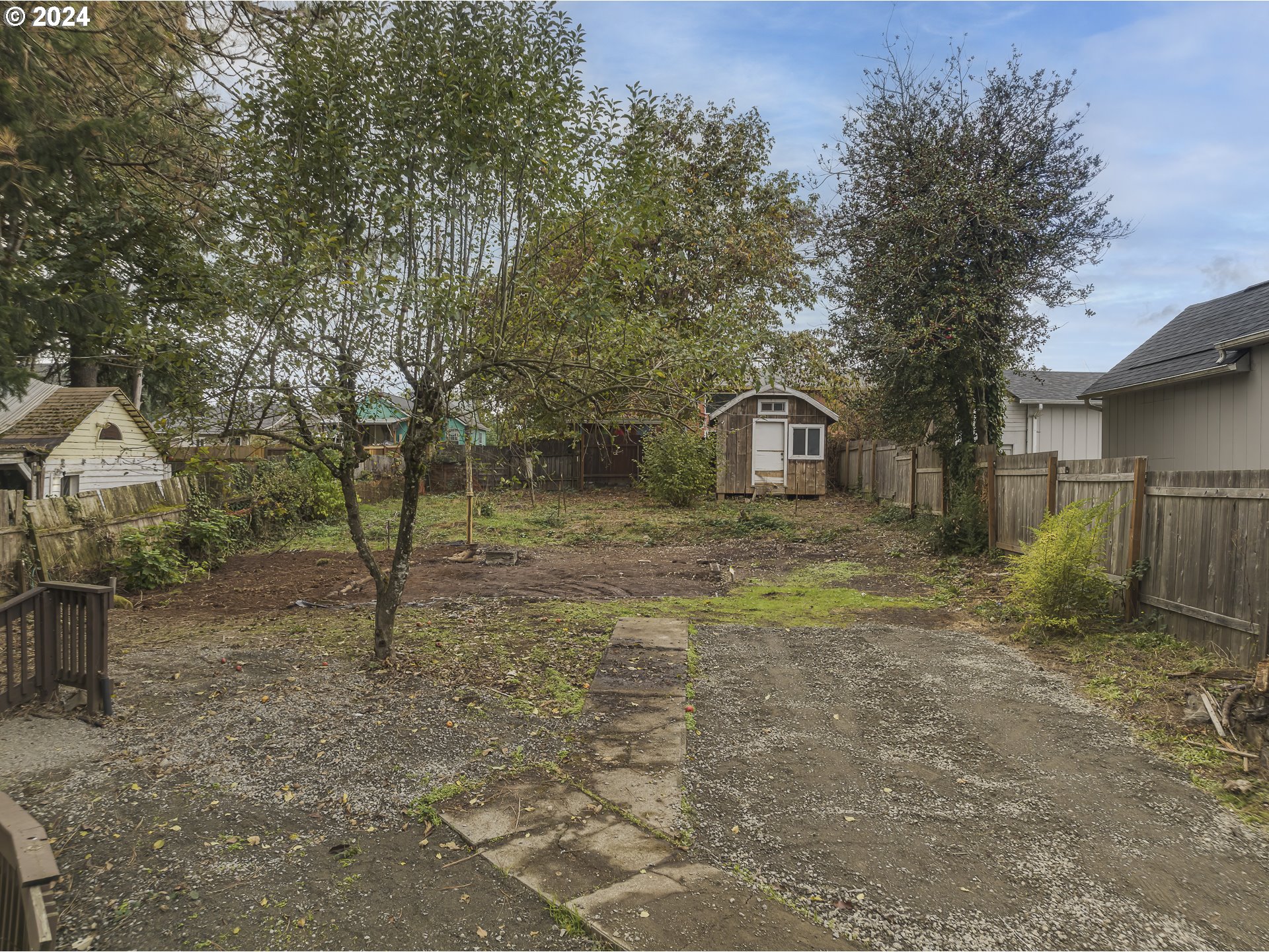 a backyard of a house with lots of green space