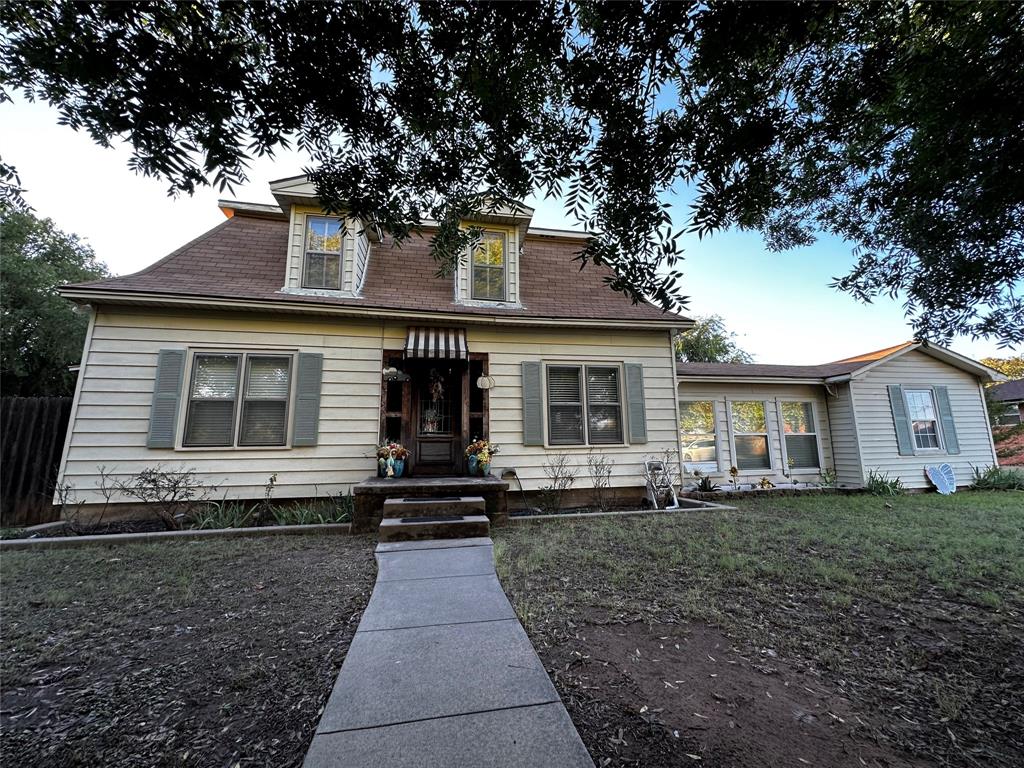 a front view of a house with yard