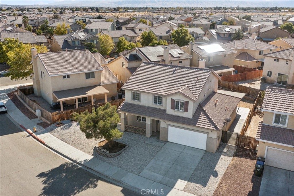 an aerial view of a house with a garden