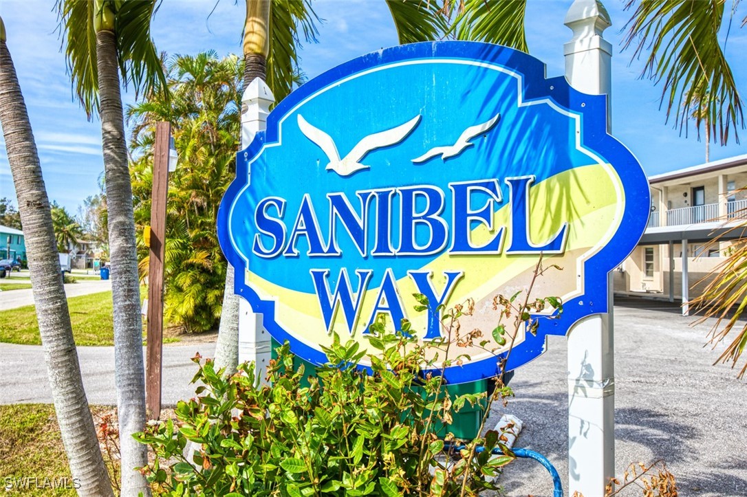 a street sign that is on a blue wall