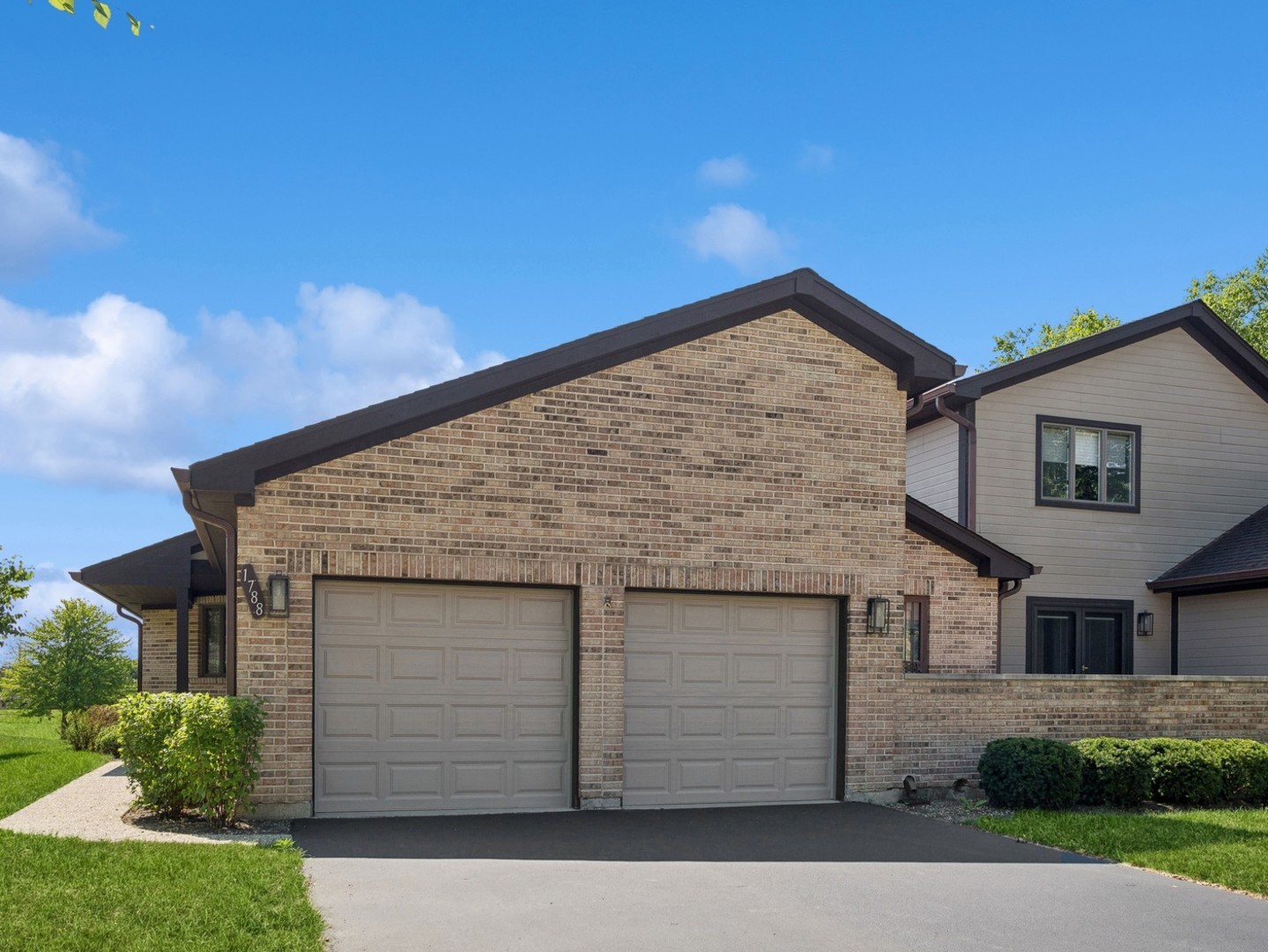 a front view of a house with a garage