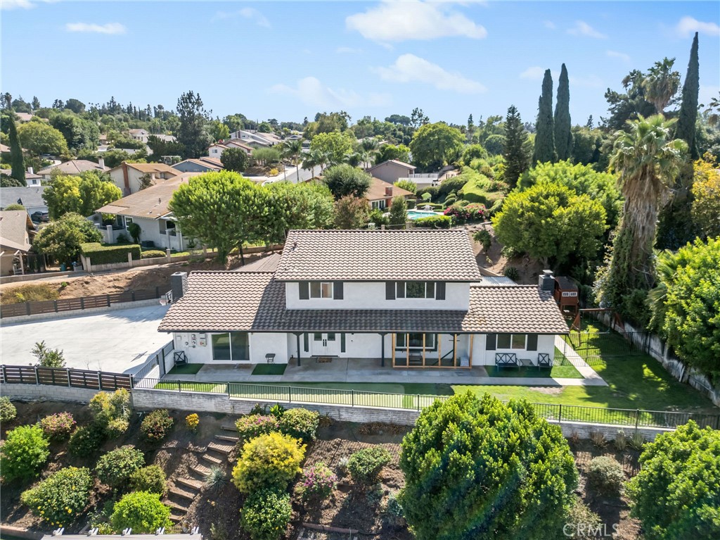 a aerial view of a house with swimming pool