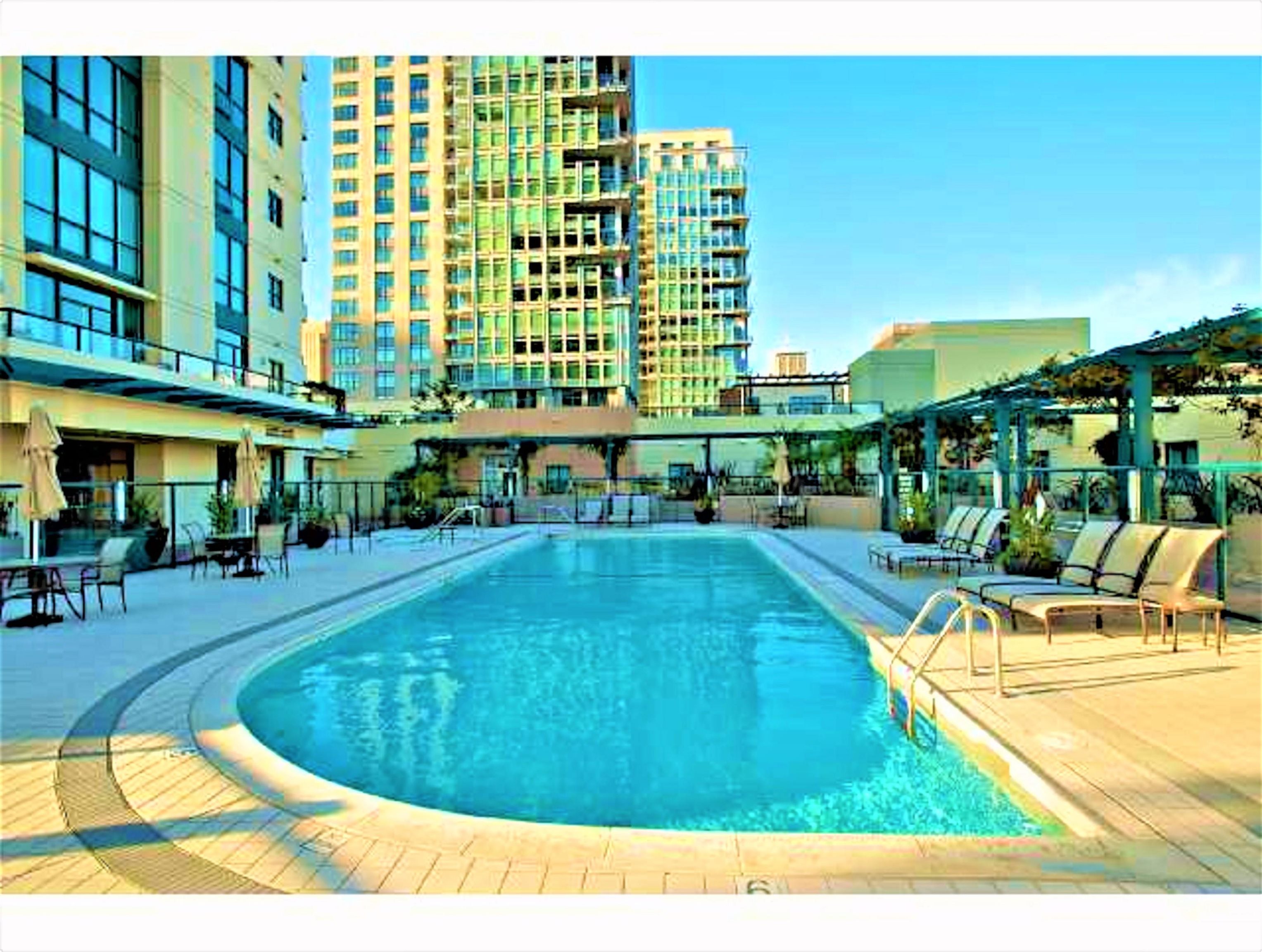 a view of swimming pool with outdoor seating