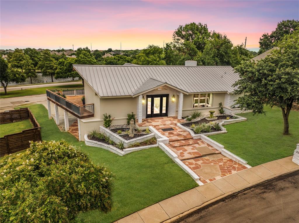 a aerial view of a house with a yard