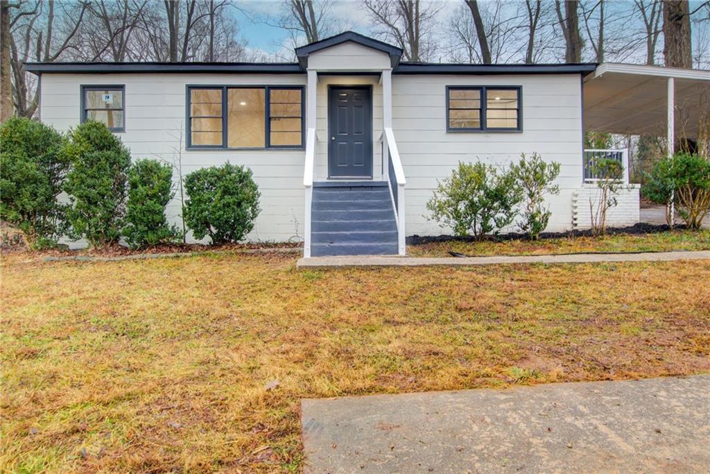 front view of a house with a yard