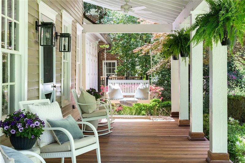 a view of a chairs and table in patio with plants