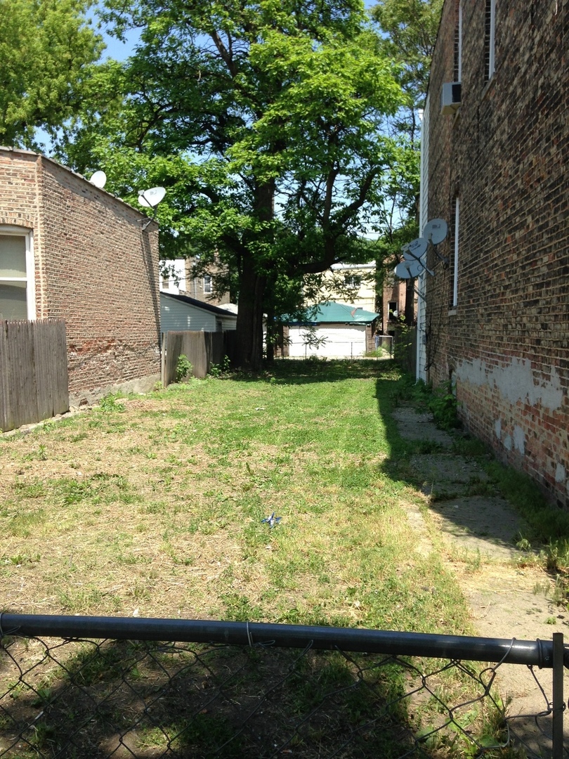 a view of a yard with an outdoor space