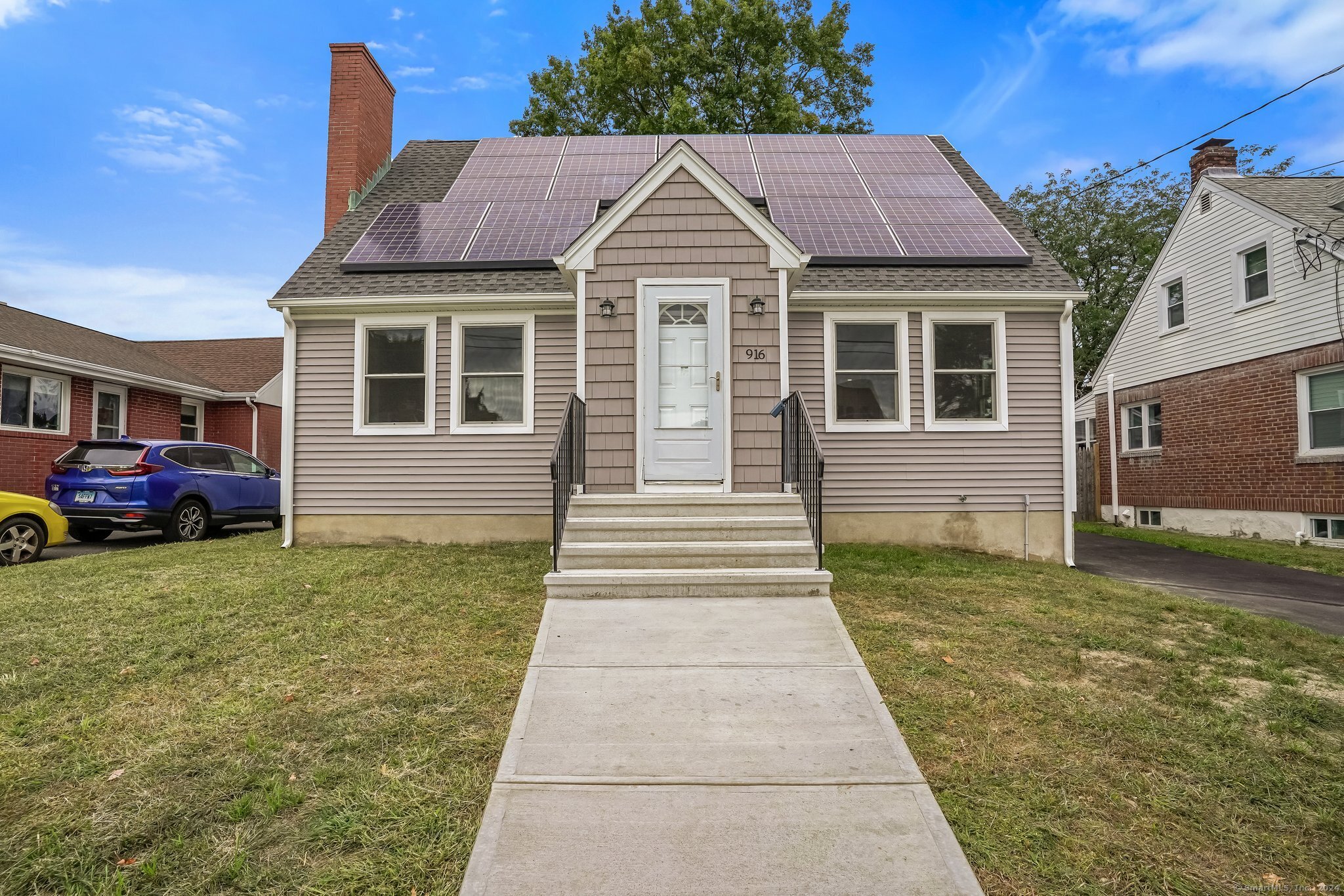 a front view of a house with a yard