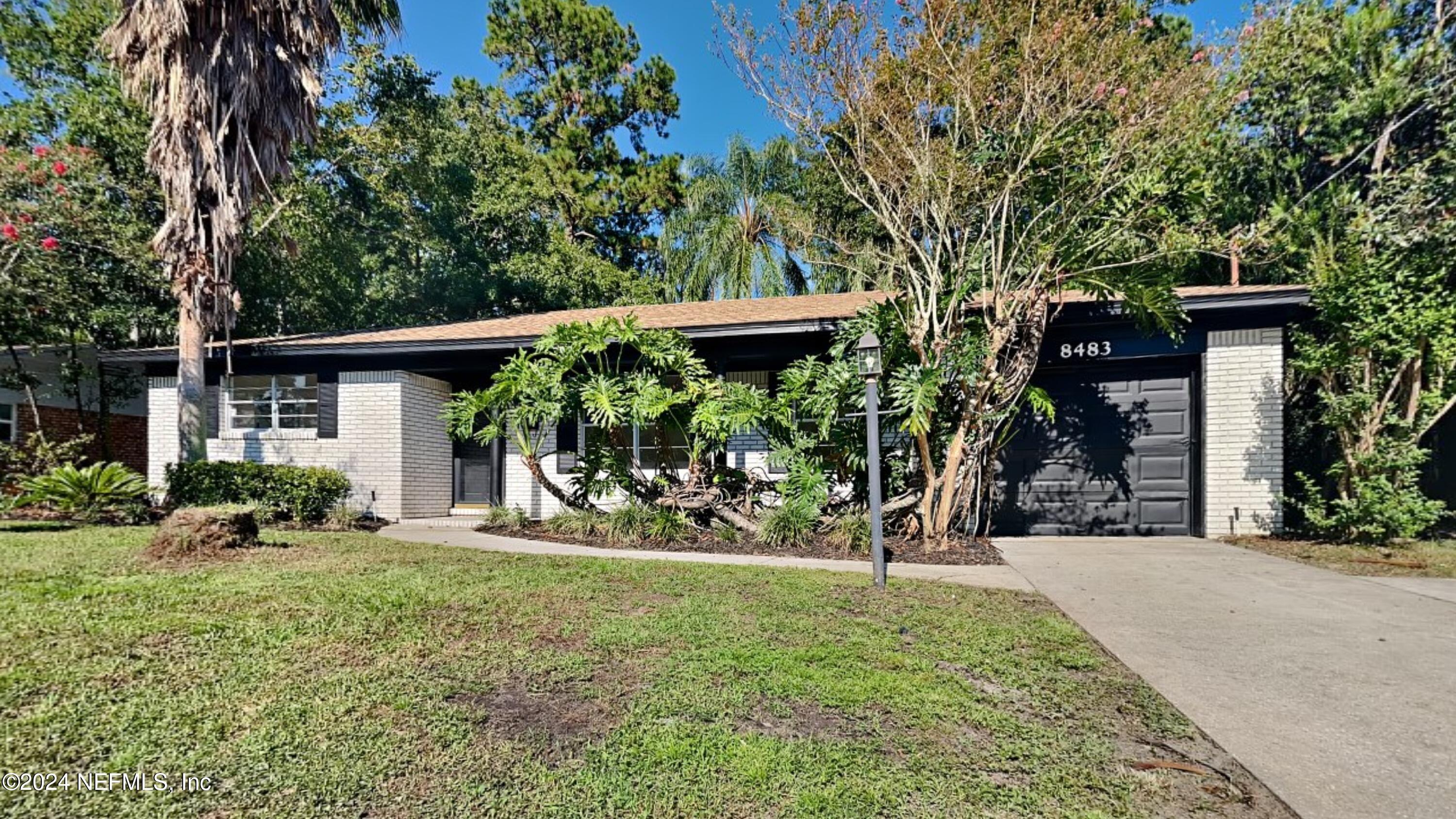 front view of a house with a yard