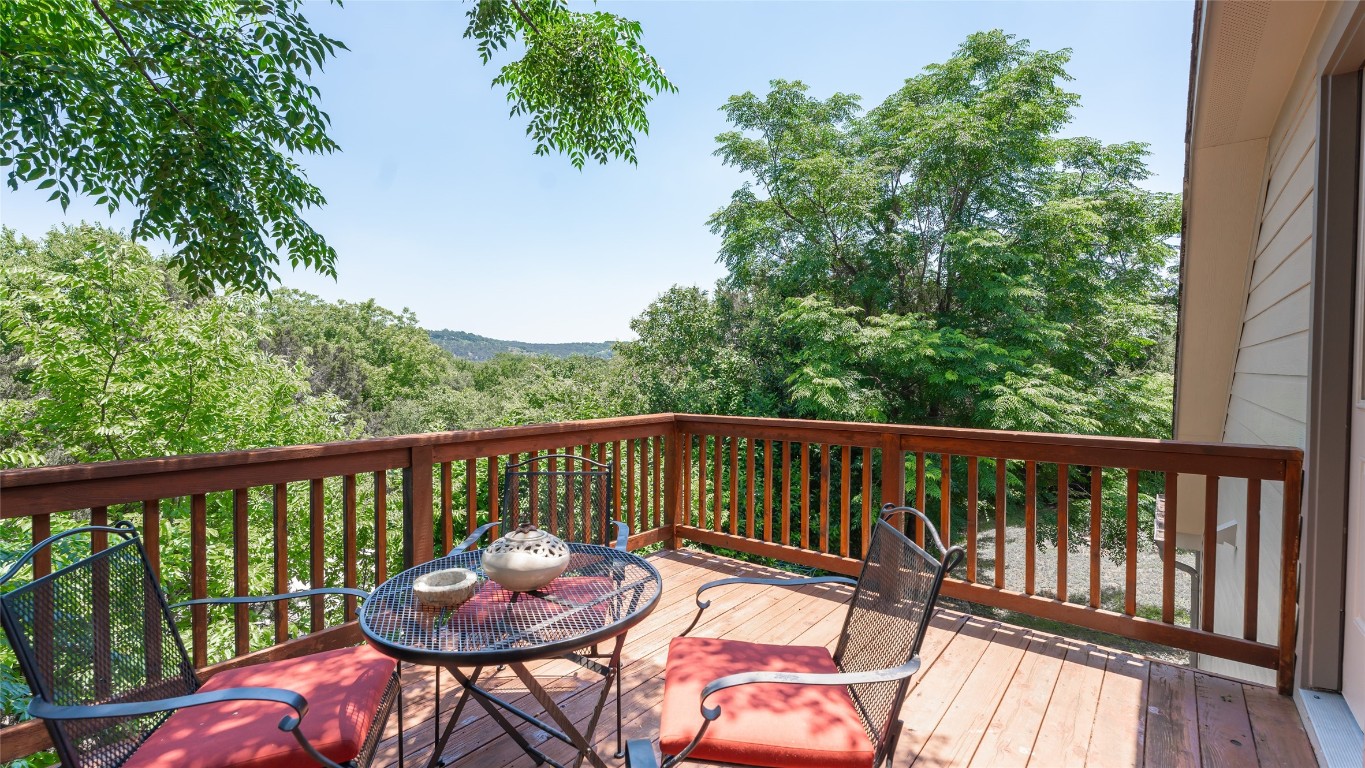 a view of a balcony with wooden floor