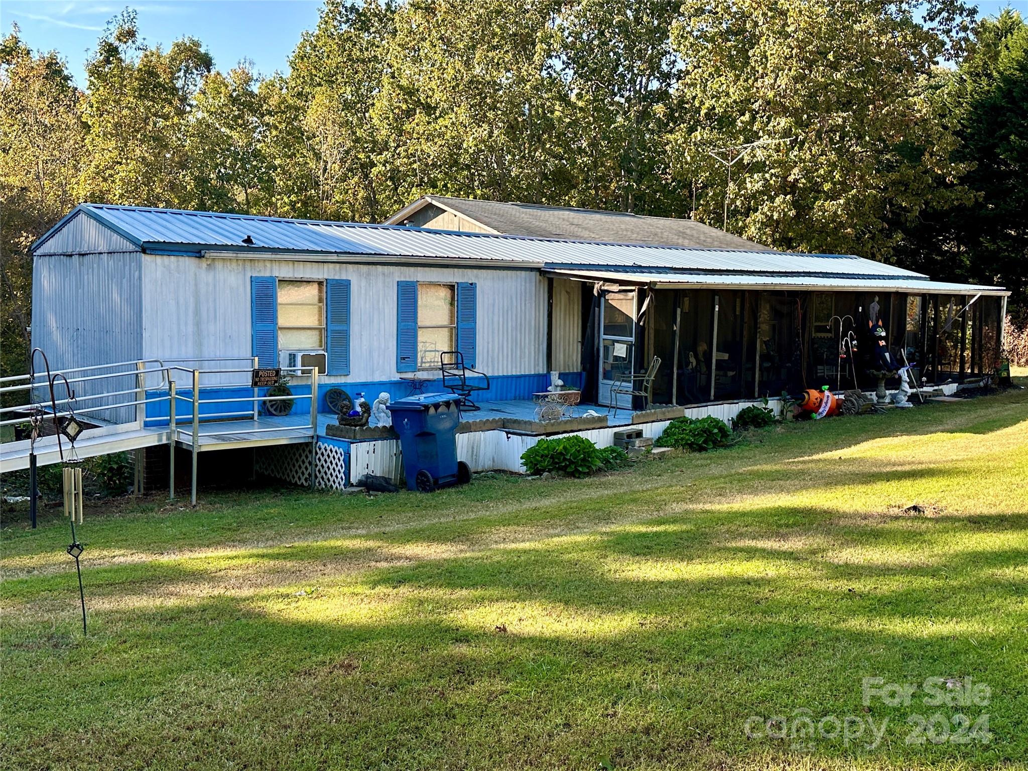 a view of a house with a yard porch and sitting area