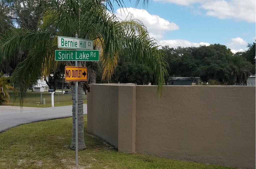 a view of a park with welcome board