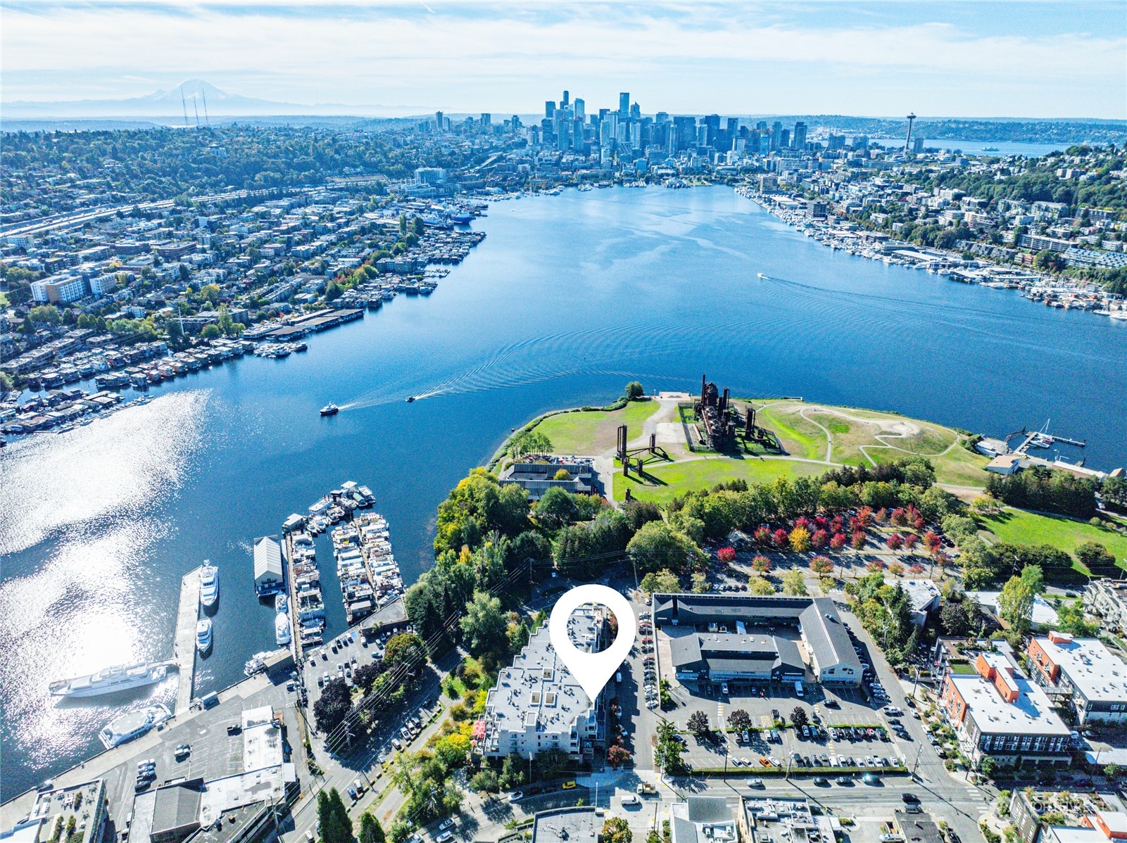 an aerial view of a houses with a lake view