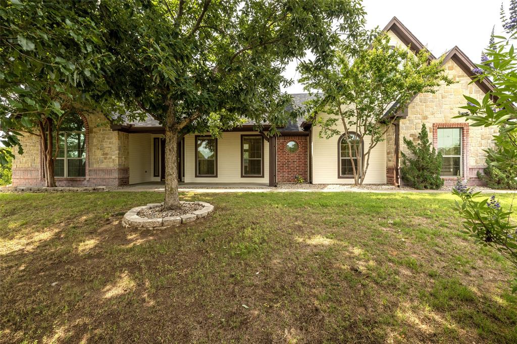 front view of a house with a yard