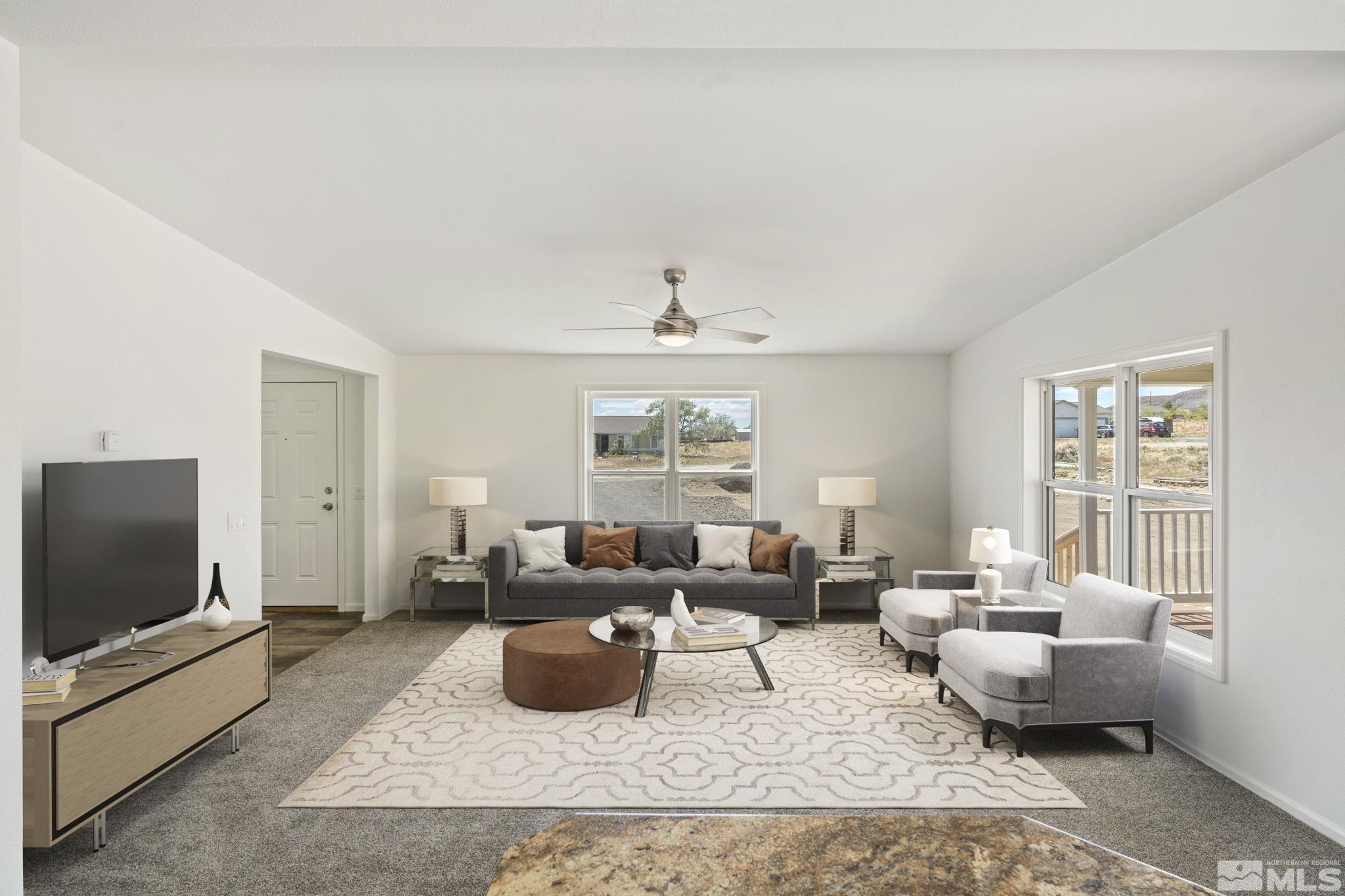 a living room with furniture wooden floor and a flat screen tv