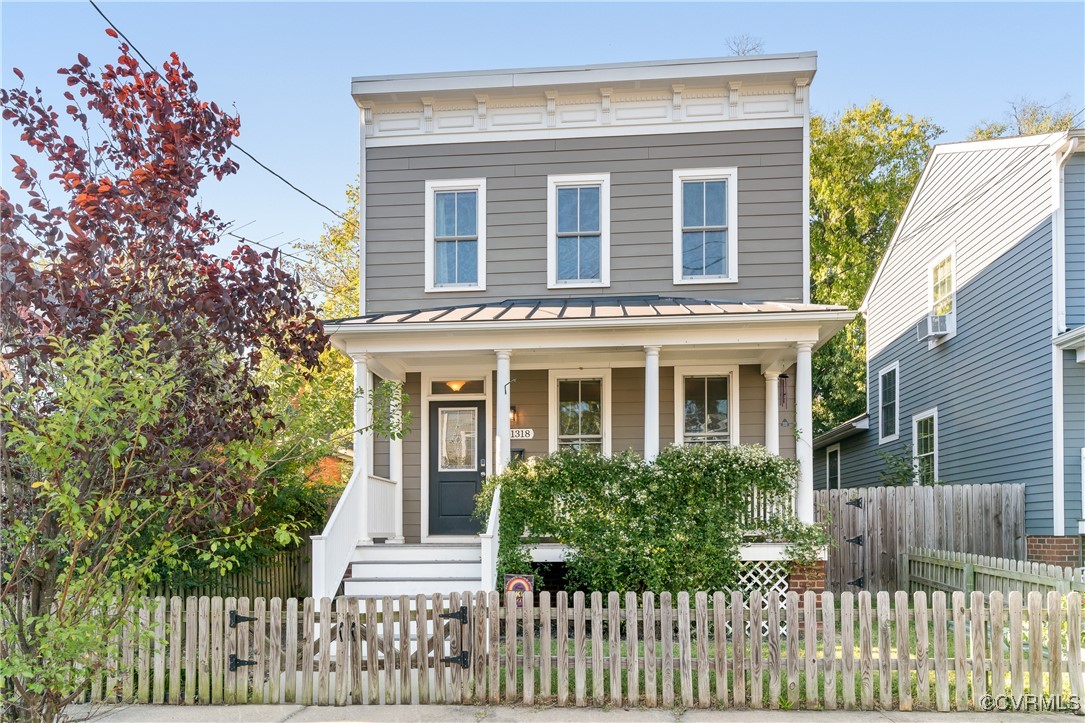 Italianate house featuring a porch