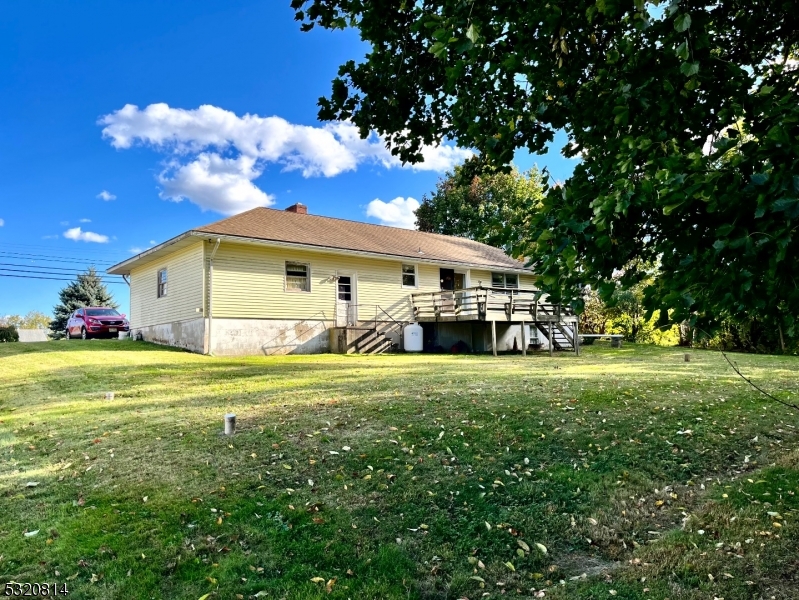 a front view of house with garden