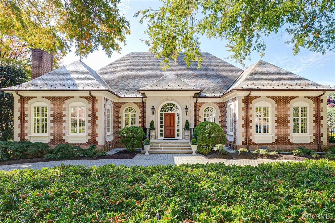 a front view of a house with garden