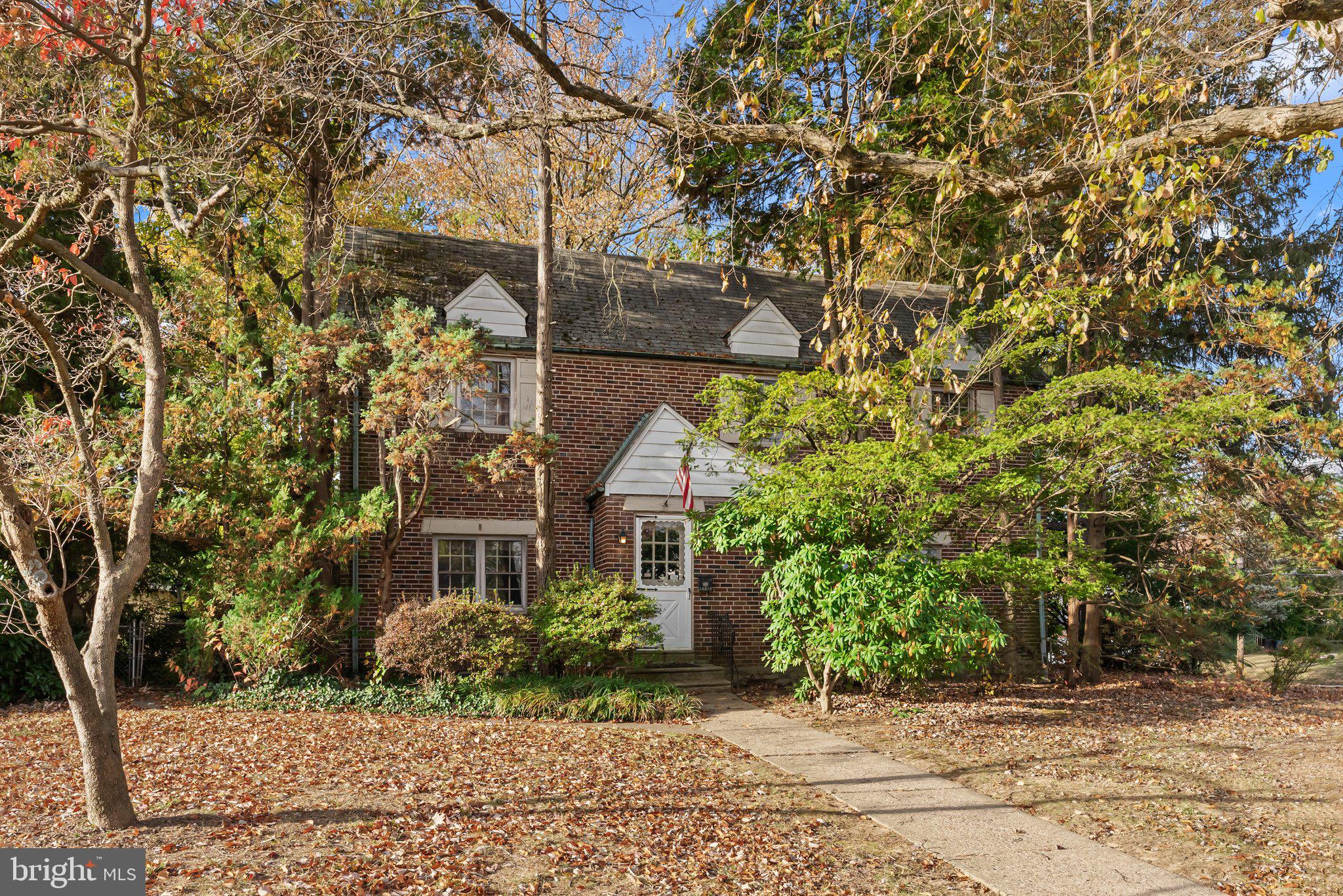 front view of a house with a tree