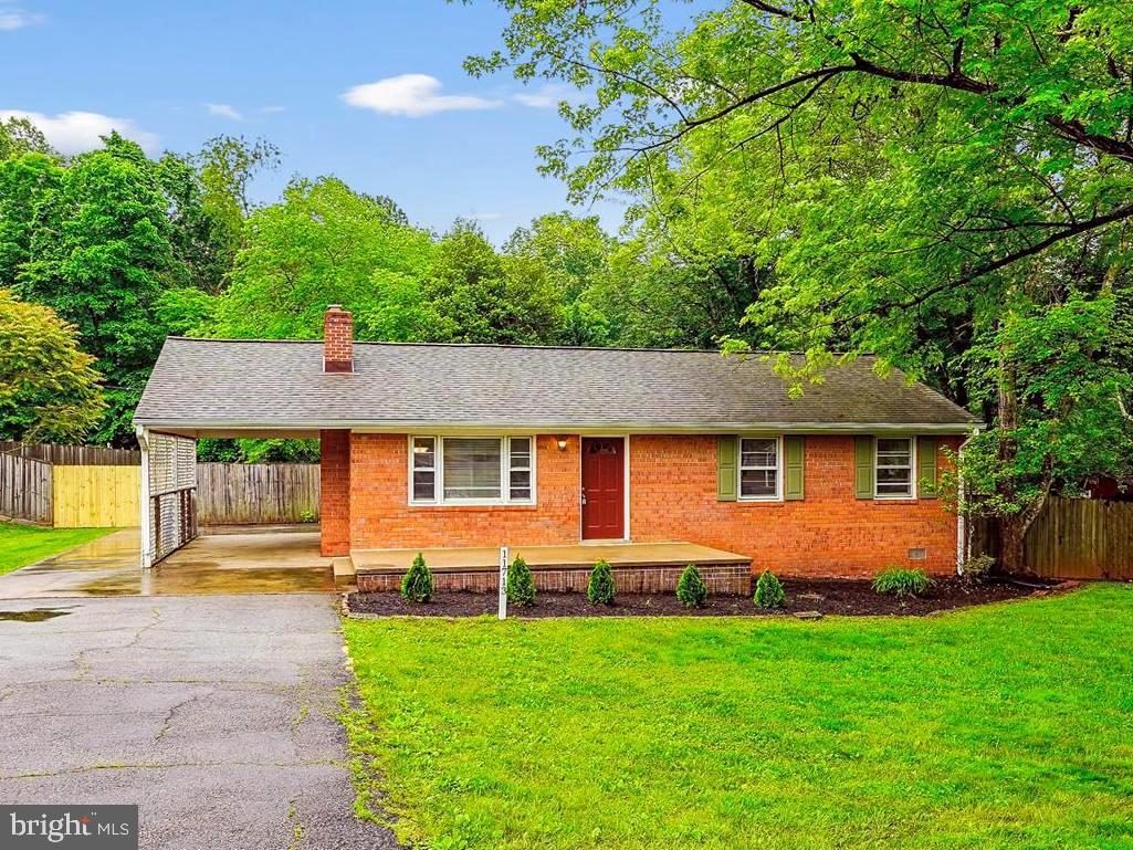 a front view of a house with yard