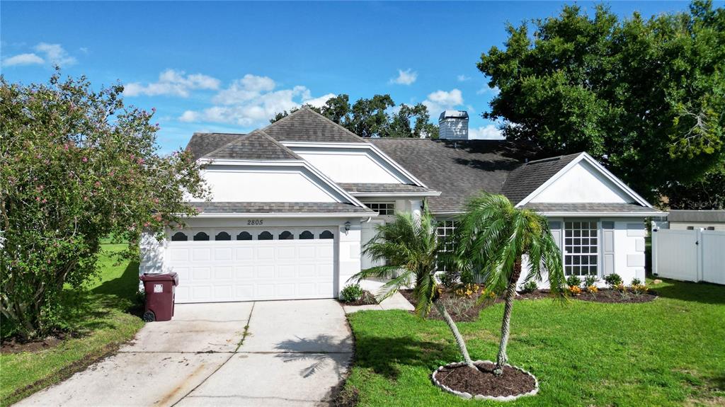 a house with garden in front of it