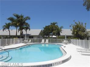 a view of a swimming pool with a lake view