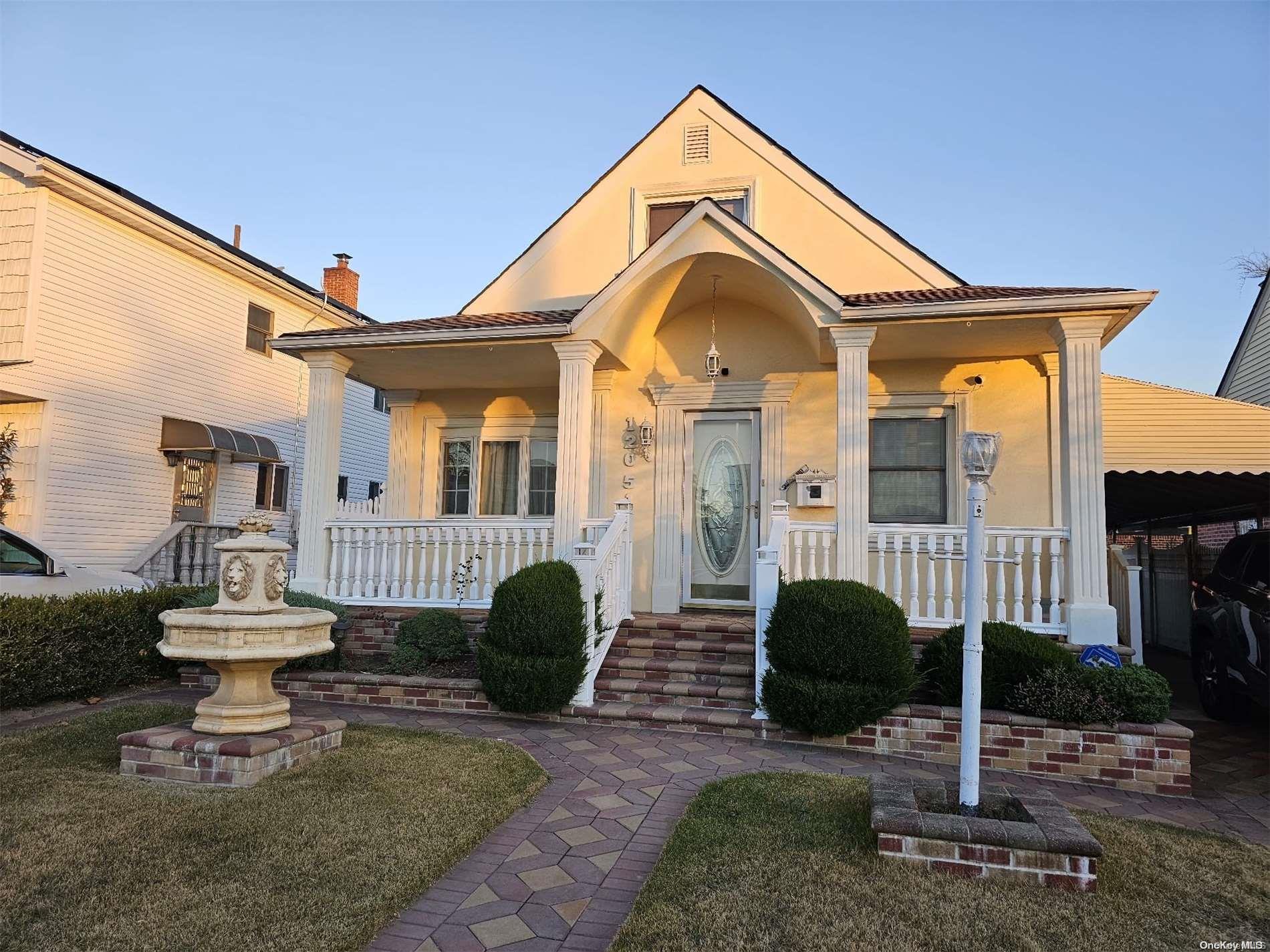 a front view of a house with a porch