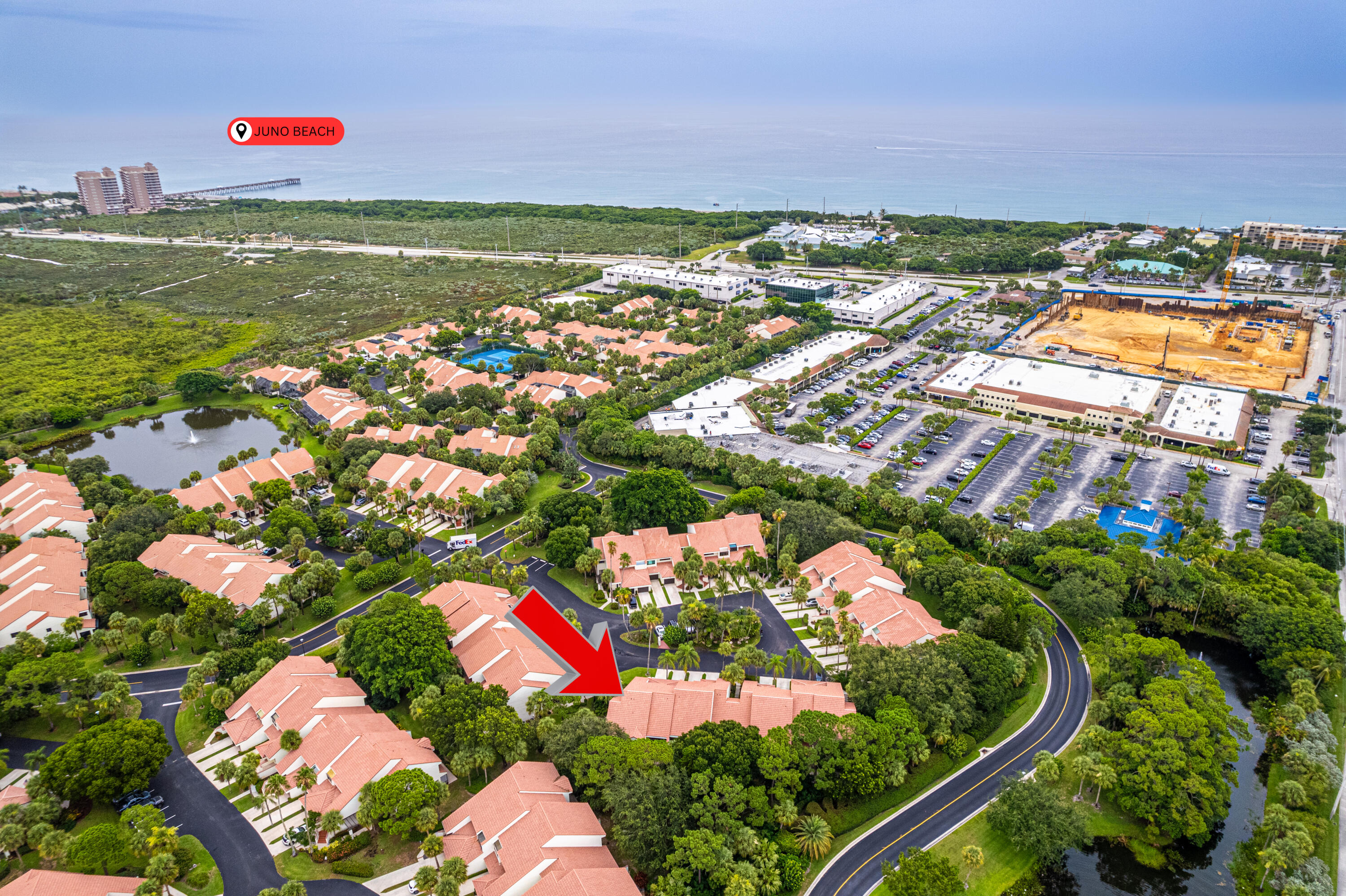 an aerial view of residential houses with outdoor space and swimming pool