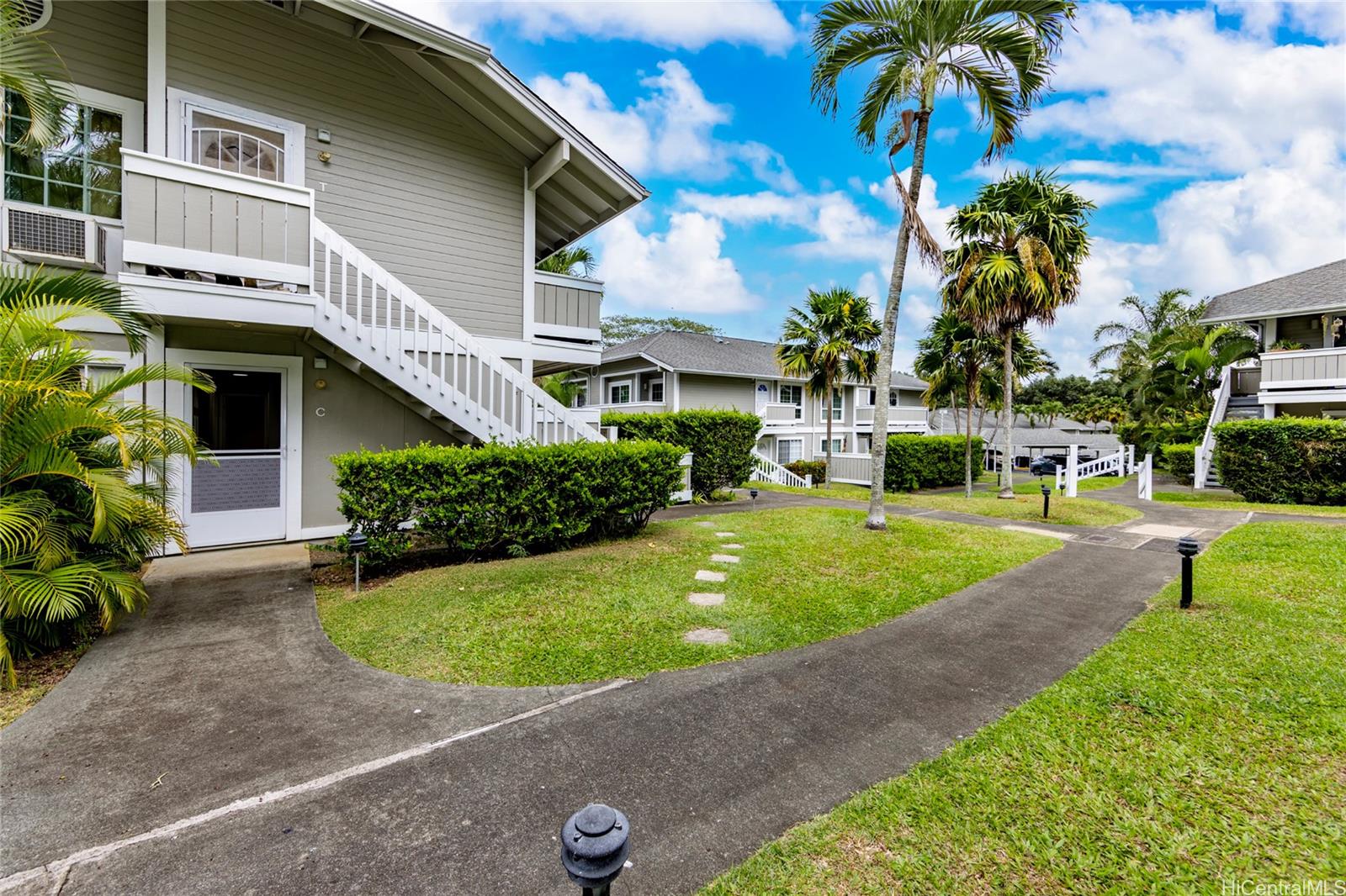 a view of a house with a backyard