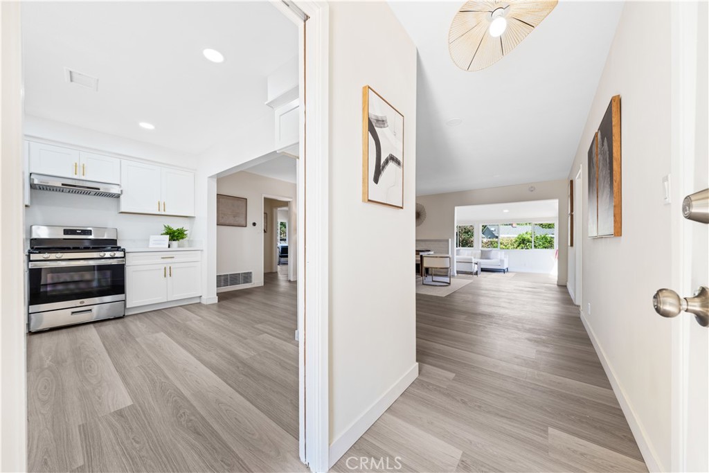 a view of a kitchen cabinets and wooden floor