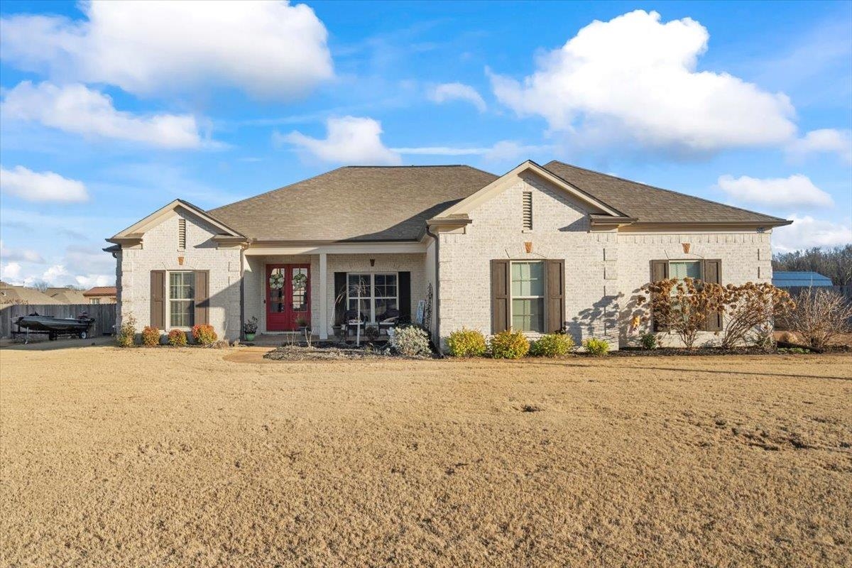 a front view of a house with a yard