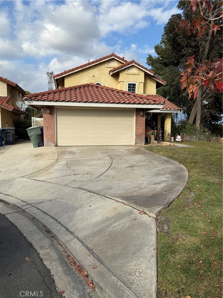 a front view of a house with yard